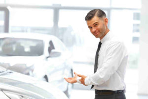 Car Salesman Offering Car